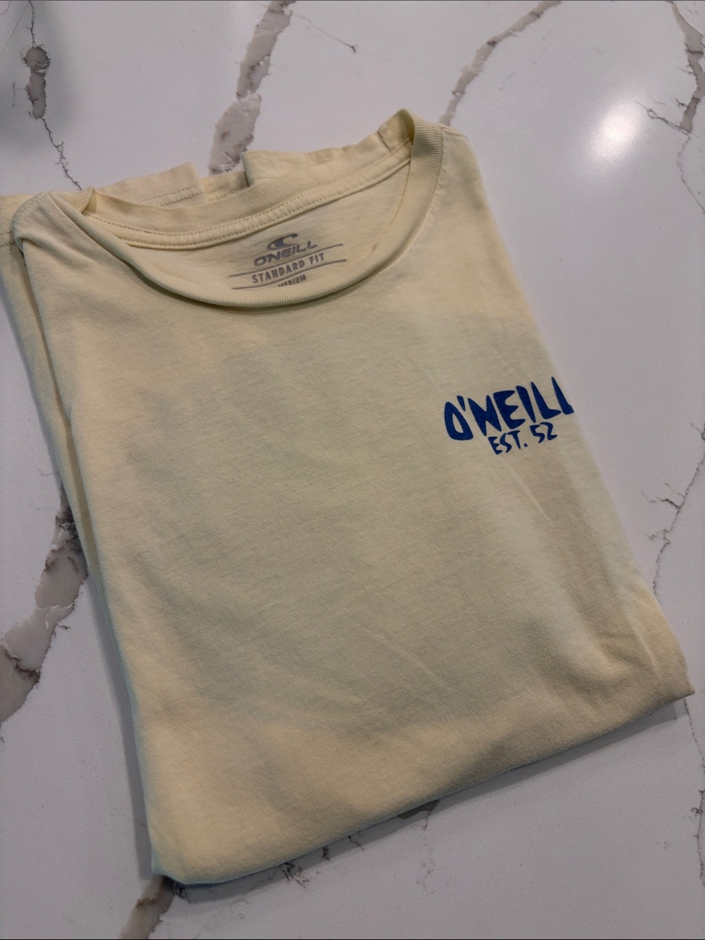 O'Neill butter yellow Short Sleeve Tee with Blue Chest Logo